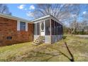 Screened porch with wooden steps and lattice at 3524 Lancaster Hwy, Monroe, NC 28112