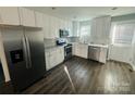 Newly remodeled kitchen with stainless steel appliances, modern fixtures, granite countertops, and freshly painted walls at 2801 Cowles Rd, Charlotte, NC 28208