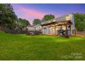 Spacious backyard with deck, pergola, and lush lawn at 1870 Lillywood Ln, Fort Mill, SC 29707