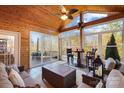 Bright sunroom features a vaulted ceiling, tiled floor, and access to deck at 7252 Shenandoah Dr, Fort Mill, SC 29707