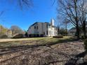 House backyard with grass and trees at 2306 Cota Ct, Charlotte, NC 28262