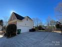 Two-car garage with large driveway at 2306 Cota Ct, Charlotte, NC 28262
