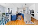 Stunning kitchen with a double island, blue cabinetry, and white countertops at 1009 Murandy Ln, Matthews, NC 28104