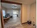 Open concept dining area, new flooring, view into living room at 110 Courtland St, Chester, SC 29706