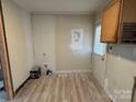 Unfinished kitchen with new flooring and partial walls at 110 Courtland St, Chester, SC 29706