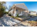 Cute house with a long driveway and inviting front porch at 138 Pinckney St, Chester, SC 29706