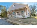 Nice gray house with a front porch, steps, and landscaping at 138 Pinckney St, Chester, SC 29706