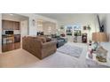 Open living space with a sectional sofa and built-in workspace at 195 Hidden Lakes Rd, Statesville, NC 28677