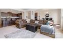 Open concept living room with a large sectional sofa and kitchen views at 195 Hidden Lakes Rd, Statesville, NC 28677