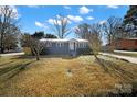 Newly painted gray ranch home with a well-maintained lawn and driveway at 206 Hunter St, York, SC 29745