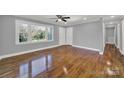 Bright living room with hardwood floors and a view into the kitchen at 206 Hunter St, York, SC 29745