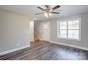 Bright living area with hardwood floors and a view of the staircase at 277 Stewart Nw St, Concord, NC 28027