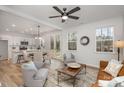 Open concept kitchen and living area, island, white cabinets, and stainless steel appliances at 3024 Sadler Woods Ln, Charlotte, NC 28214