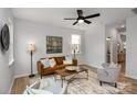 Living room with a leather couch, armchairs, and a coffee table at 3024 Sadler Woods Ln, Charlotte, NC 28214