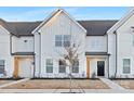 Inviting townhome showcases modern white siding and a beautifully landscaped front yard at 332 Ginsberg Rd, Rock Hill, SC 29732