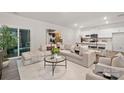 Bright living room with a comfortable sectional sofa, modern decor, and sliding door at 332 Ginsberg Rd, Rock Hill, SC 29732