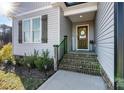 Brick steps leading to a charming front door with sidelights at 3636 Kimber Ln, Sherrills Ford, NC 28673