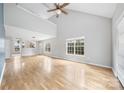 Spacious living room with vaulted ceiling and hardwood floors at 6078 Bobcat Pl, Charlotte, NC 28269