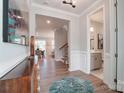 Bright and spacious foyer with hardwood floors and a half bathroom at 9835 Quercus Ln, Huntersville, NC 28078