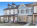 Two-story townhouse with white and blue siding, brick accents, and a front porch at 1066 Riverwalk Pkwy, Rock Hill, SC 29730