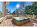 Hot tub on deck overlooking backyard and trees at 111 Rapids Run Trl # 17, Iron Station, NC 28080