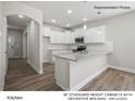 Modern kitchen with island, white cabinets, granite countertops at 13119 Hamilton Rd, Charlotte, NC 28273