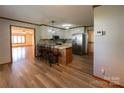 Eat-in kitchen with island and view of living room at 1544 Daybreak Ridge Rd, Kannapolis, NC 28081