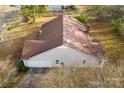 House rear view, showcasing garage and yard at 2411 Hamilton Mill Rd, Charlotte, NC 28270