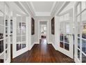 Hardwood floor hallway with white doors and gray walls at 301 W 10Th St # 205, Charlotte, NC 28202