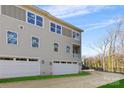 Three-story townhome with attached garage and small yard at 3713 Lou Ann Ave, Charlotte, NC 28208