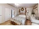 Cozy bedroom with rustic decor and ensuite bathroom access at 5120 Gates Dr, Denver, NC 28037