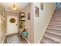 Bright entryway with decorative console table and staircase at 612 Spencer Ln, Kannapolis, NC 28081