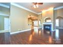 Spacious living room with hardwood floors and fireplace at 7757 St Andrews Ln, Stanley, NC 28164