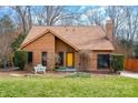 Inviting exterior of a charming single story home with a well-manicured lawn at 8149 Mattingridge Dr, Charlotte, NC 28270