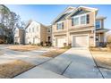 Three townhouses with attached garages and landscaping at 18106 Pear Hawthorne Dr, Huntersville, NC 28078
