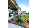 Inviting front porch features a cozy seating area and well-maintained landscaping at 3100 Glacier Ct, Gastonia, NC 28056