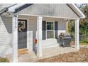 Front porch with grill and welcoming decor at 506 Broadway Ct # 9, Statesville, NC 28677