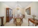 Formal dining room with wood table and chairs, and large window at 5550 Monticello Nw Dr, Concord, NC 28027
