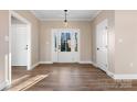 Bright entryway with light hardwood floors and access to other rooms at 9181 Cherokee Dr, Hickory, NC 28601