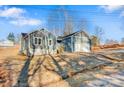 Newly built home with gray siding, two-car garage, and a spacious yard at 9181 Cherokee Dr, Hickory, NC 28601