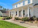 Two story home with charming front porch and rocking chairs at 116 Cedar Branch Ct, Mooresville, NC 28117