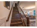 Modern staircase with dark wood treads and metal railing at 1305 39Th Avenue Ne Pl, Hickory, NC 28601