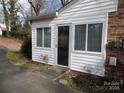 Small white shed with a door and windows at 211 Walnut Ave, Mount Holly, NC 28120