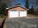 Detached two-car brick garage with driveway at 211 Walnut Ave, Mount Holly, NC 28120