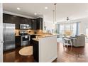 Modern kitchen with stainless steel appliances and granite countertops at 2430 Kensington Station Pkwy, Charlotte, NC 28210