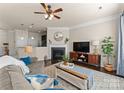 Cozy living room with fireplace and built-in shelving at 2430 Kensington Station Pkwy, Charlotte, NC 28210