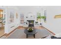 Bright living room with a fireplace, modern furnishings, and abundant natural light at 3304 Caernarvon Ct, Fort Mill, SC 29715