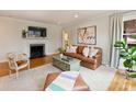 Living room with fireplace and leather furniture at 3624 Trent St, Charlotte, NC 28209