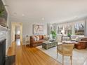 Spacious living room with hardwood floors and fireplace at 3624 Trent St, Charlotte, NC 28209