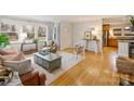 Bright living room, hardwood floors, view to kitchen at 3624 Trent St, Charlotte, NC 28209